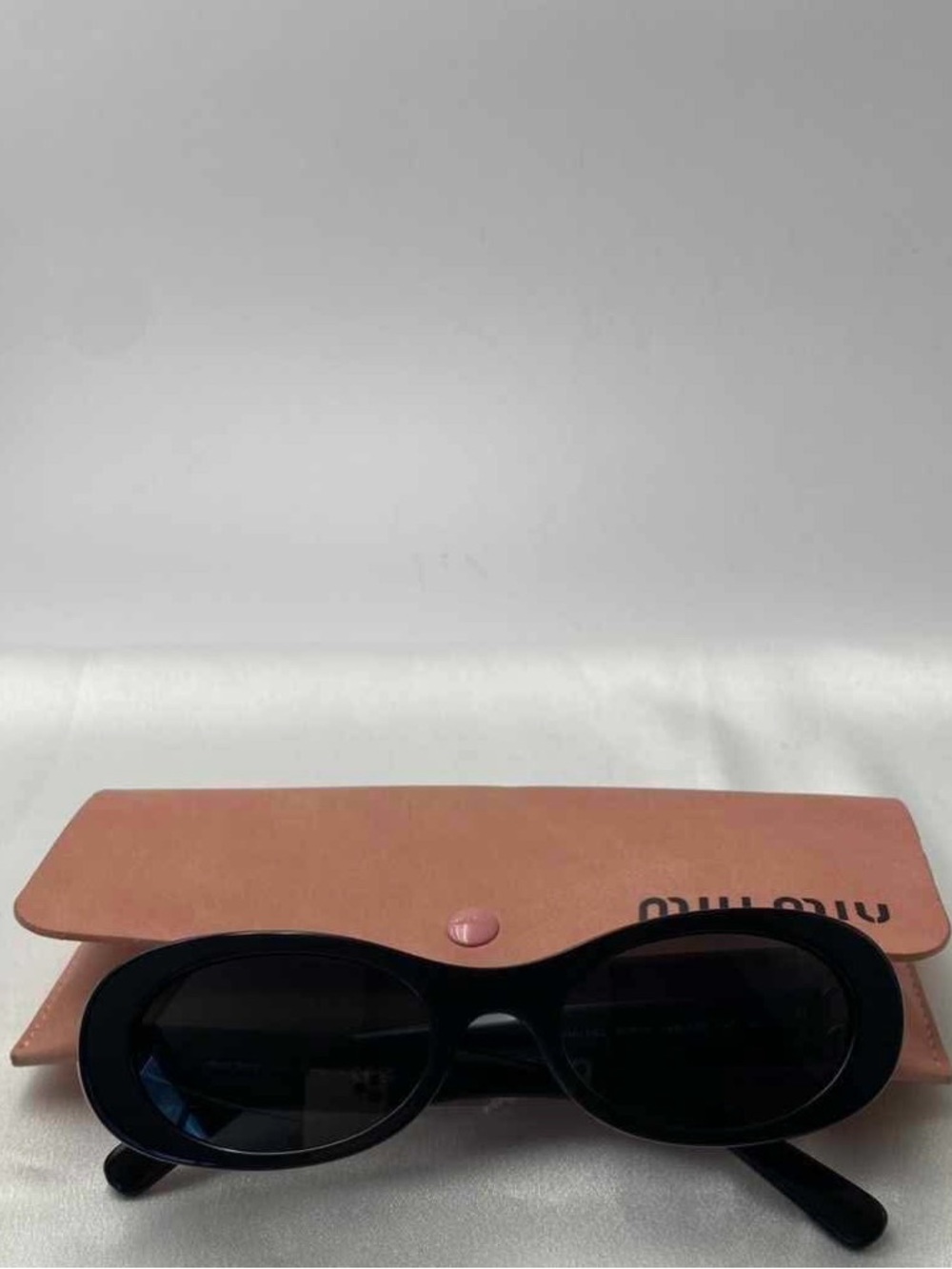 Miu Miu Black Oval Women's Sunglasses with Pink Case